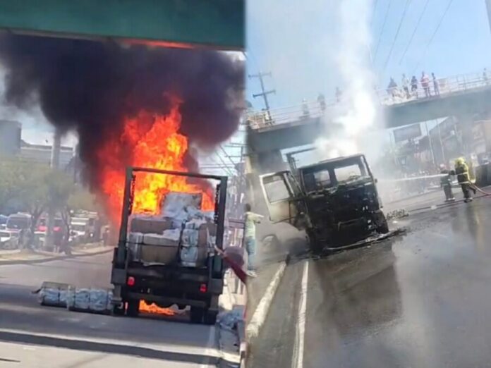 Caminhão de reciclagem pega fogo em Manaus durante ocorrência atendida pelos bombeiros.